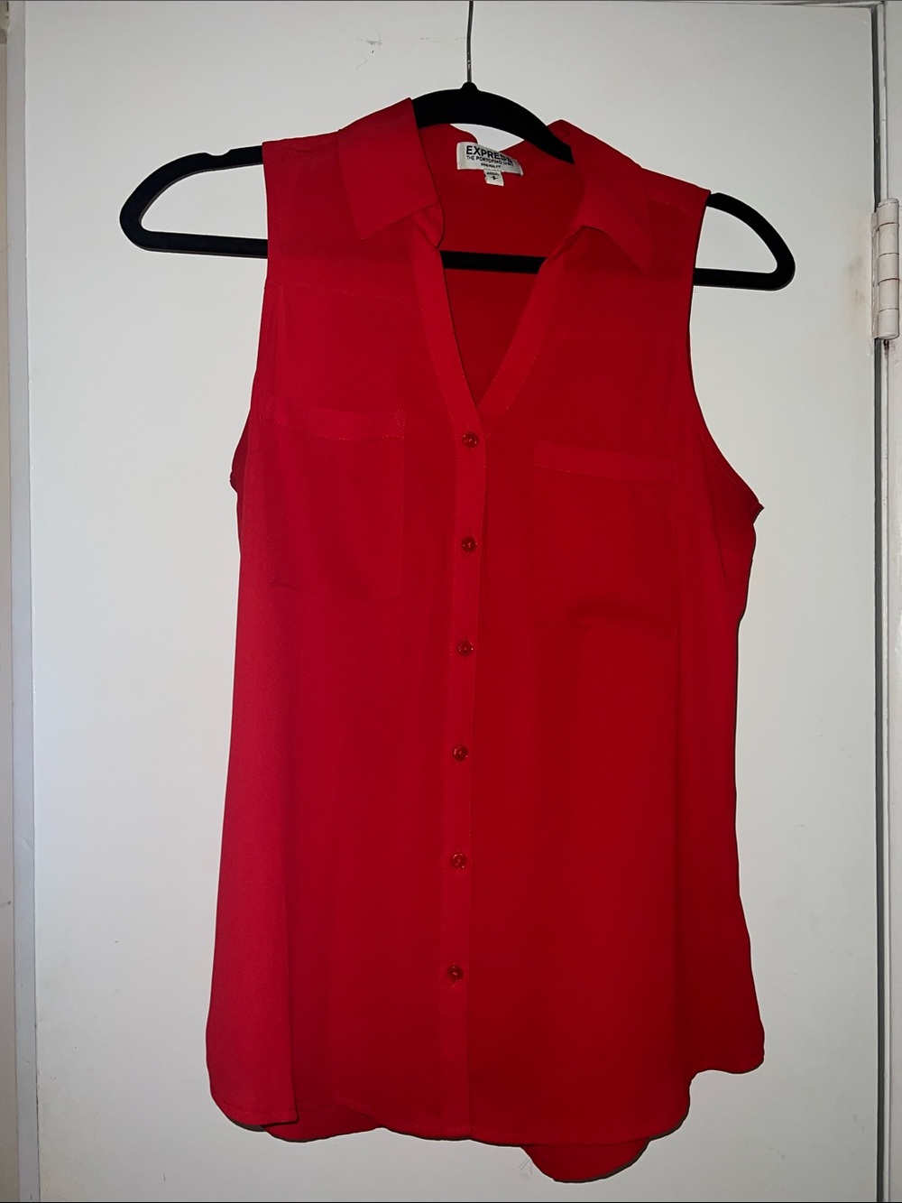 Sleeveless button down top